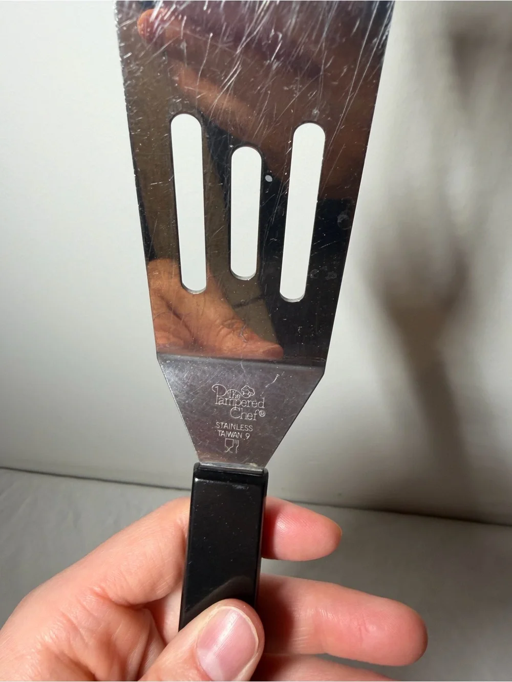Pampered Chef Stainless Steel Slotted Turner with Black Handle